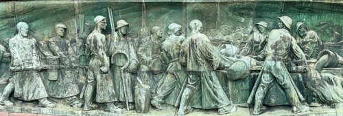 Part of monument Detail of manufacture Production of crucible steel Crucible steel production left Liquefaction of casting material in melting furnaces right Pouring of liquid steel Filling of mould C...
