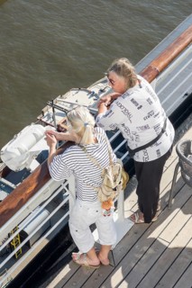 Passengers looking over the railing