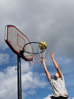 Basketball Jump with the ball to the basket and net