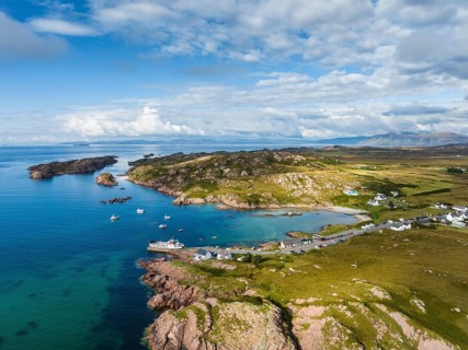 Aerial view of Fionnphort Bay with ferry pier and the ferry MV Loch Buie operating a scheduled service between Fionnphort and the Isle of Iona