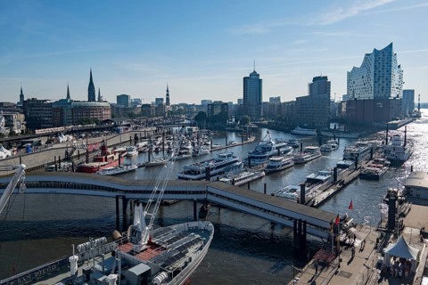 View of Niederhafen harbour and the museum ship Cap San Diego at the Ueberseebruecke bridge in the Port of Hamburg from a cruise ship