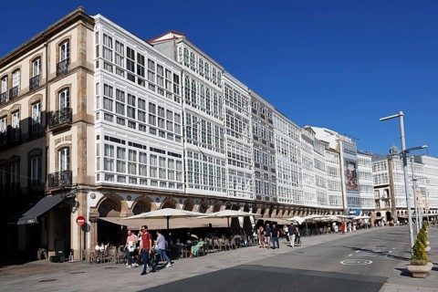 Decorative house facades on the harbour promenade in the historic city centre of La Coruna