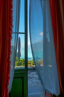 Balcony View from The Historical Grandhotel Giessbach with View over Mountain and Lake Brienz with Sunlight in Giessbach