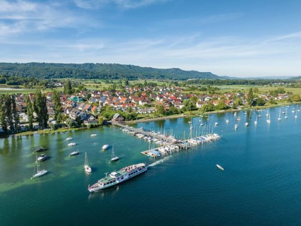 Aerial view of the jetty and marina of the Lake Constance municipality of Iznang on the Hoeri peninsula with the cruise ship MS Reichenau