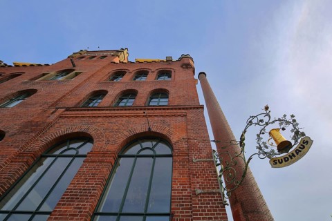 Red brewhouse with chimney and nose shield