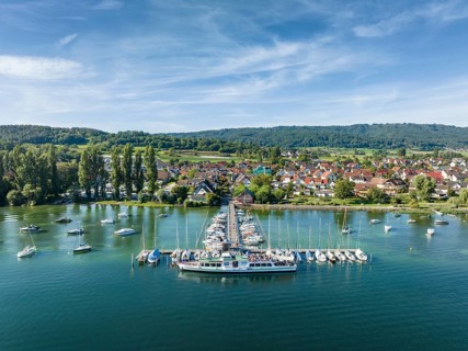 Aerial view of the jetty and marina of the Lake Constance municipality of Iznang on the Hoeri peninsula with the cruise ship MS Reichenau