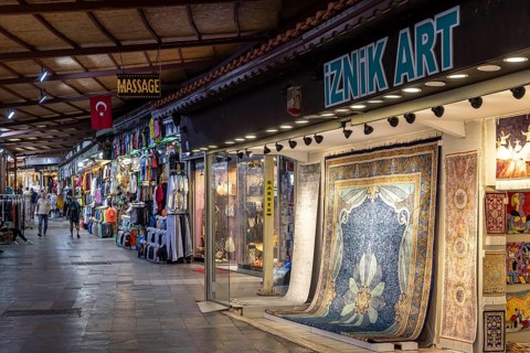 Bazaar in Kusadasi with clothes and carpets