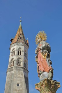 Church tower of the neo-Romanesque St. John's Church and Madonna figure from the market fountain