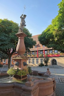 Neptune Fountain with Sculpture and Half-half-timbered house House Savings Bank
