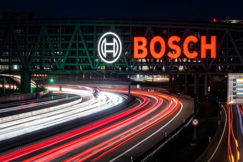 A8 motorway at Stuttgart Airport with Bosch multi-storey car park. The 440-metre-long structure provides space for 4200 vehicles. Bosch has the naming rights