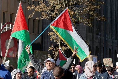 Demo participants with Palestine flag on Koenigsallee