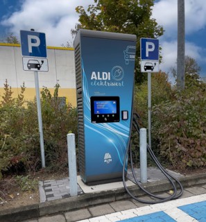 Charging station for e-car in front of supermarket of supermarket chain Aldi Sued next to it traffic sign Parking spaces for two e-cars can be charged
