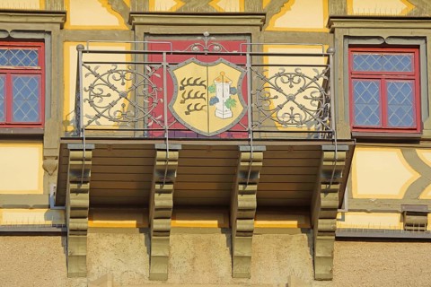 Balcony with town coat of arms and metal railing from the Upper Gate Tower