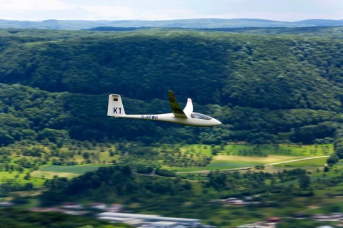 Glider flying over Unterlenningen in the Swabian Alb