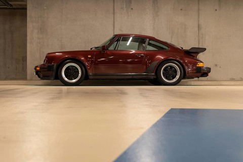 Wine-red Porsche in an underground car park