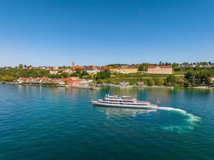 Aerial view of the town of Meersburg and the departing cruise ship MS Vorarlberg