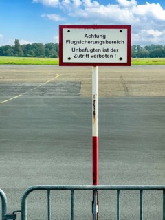 Prohibition sign Attention air traffic control area Unauthorised persons are not allowed to enter