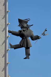 Sculpture Kasperl from Max and Moritz on a house wall