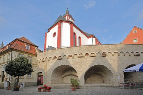 Stone wall with archways and St. Augustine's Church