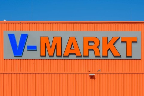 Orange facade with logo and lettering