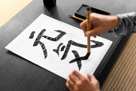 Close up hand painting paper
