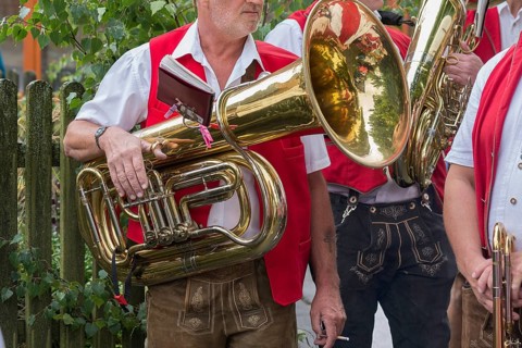 Musician holds his tuba ready to play