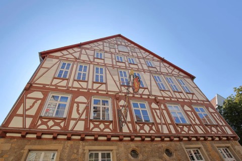 House facade with nose shield of the historic hospital built in 1360