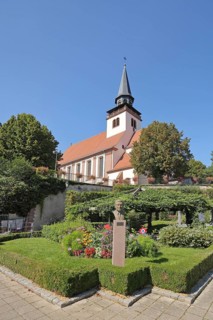 Monument to historian Josef Hemmerle and Holy Trinity Church