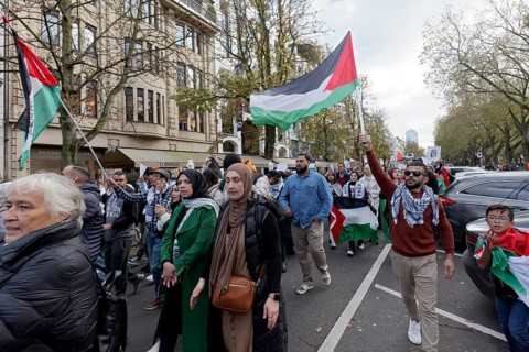 Demo participants with Palestine flags