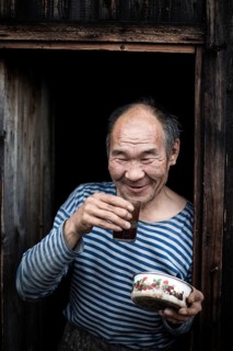Hermit in front of his hut