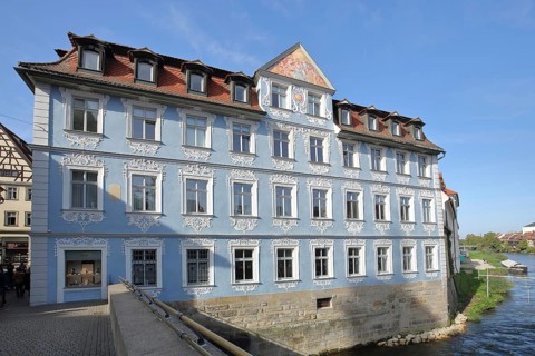Blue Heller House with ornamentation and stucco on the Regnitz River