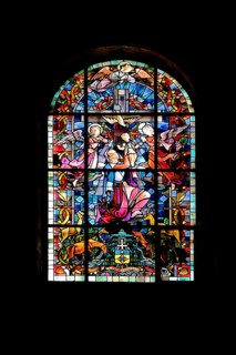 Stained glass window with Our Lady