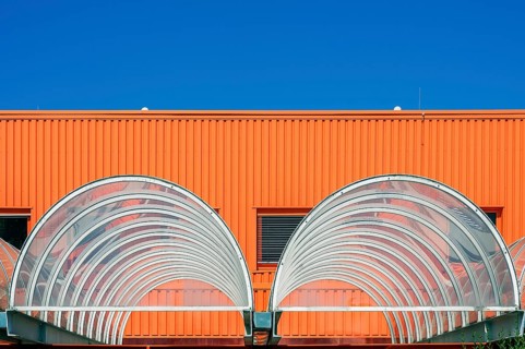 Orange facade and acrylic glass roofing