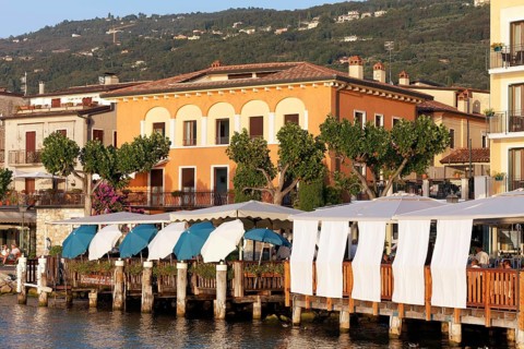 Restaurant terraces with sunshades on the lakeshore