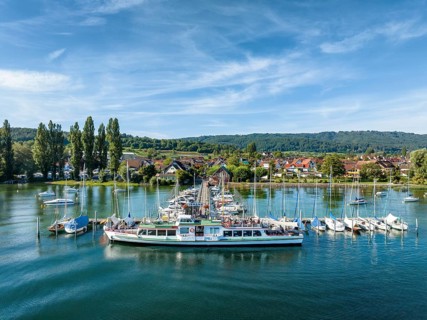Aerial view of the jetty and marina of the Lake Constance municipality of Iznang on the Hoeri peninsula with the cruise ship MS Reichenau