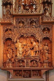 Late Gothic high altar with wood carving with saint by Christoph von Urach 1520 in the St. Cyriakus town church
