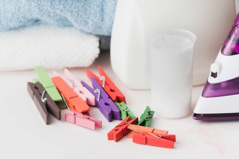 Close up detergent cup with pegs