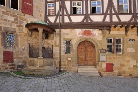 House facade with historic draw well