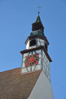 Church tower with clock of the Gothic Church of St. Nicholas