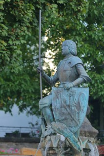 Sculpture Saint George with shield and city coat of arms