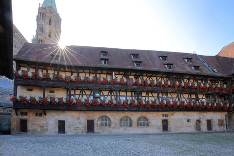 Inner courtyard of the Alte Hofhaltung built 15th century with floral decoration in the backlight