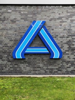 Logo A in blue without lettering on wall of supermarket of retail chain supermarket Aldi Nord
