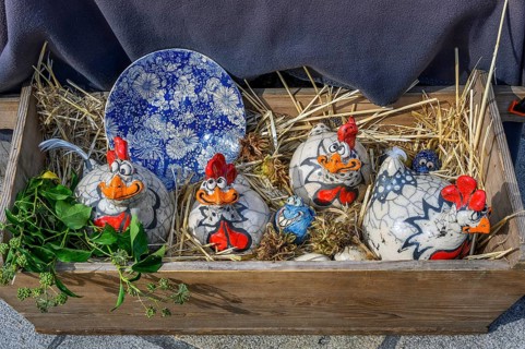 Funny ceramic chickens at the pottery and handicraft market