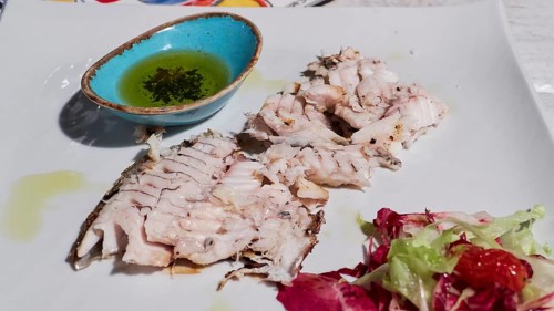 Filleted grilled fish on plate