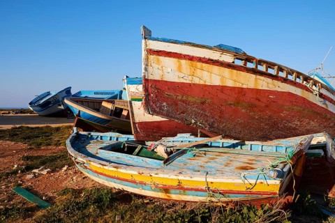 Colourful boats on top of each other