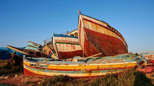 Colourful boats above and next to each other