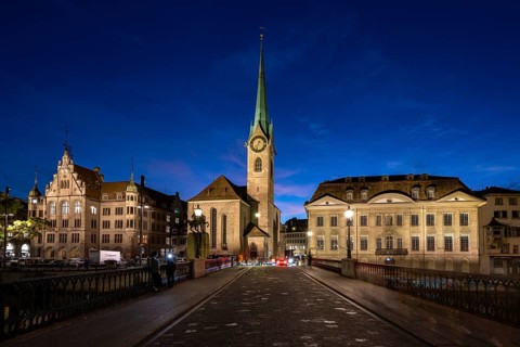 Fraumünster with Stadthaus and Münsterhof from Münsterbrücke at dusk