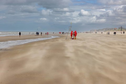 Sand kicked up during storm on the North Sea coast in De Panne