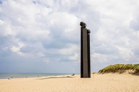 The sculpture The Three White Noses on the beach of De Panne