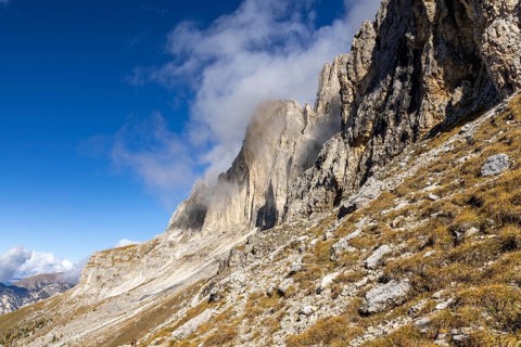 Wisps of clouds drift over the peaks